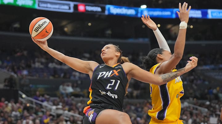 Jul 7, 2024; Los Angeles, California, USA; Phoenix Mercury forward Mikiah Herbert Harrigan (21) and LA Sparks forward Azura Stevens (23) battle for the ball in the second half at Crypto.com Arena. Mandatory Credit: Kirby Lee-Imagn Images Jul 7, 2024; Los Angeles, California, USA; Phoenix Mercury forward Mikiah Herbert Harrigan (21) and LA Sparks forward Azura Stevens (23) battle for the ball in the second half at Crypto.com Arena. Mandatory Credit: Kirby Lee-Imagn Images