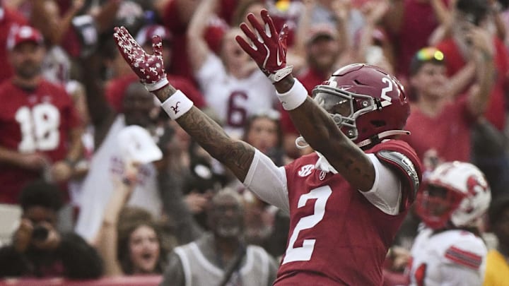 Aug 31, 2024; Tuscaloosa, Alabama, USA; Alabama Crimson Tide wide receiver Ryan Williams (2) celebrates after scoring a touchdown against the Western Kentucky Hilltoppers during the first half at Bryant-Denny Stadium.  Mandatory Credit: Gary Cosby Jr.-Imagn Images