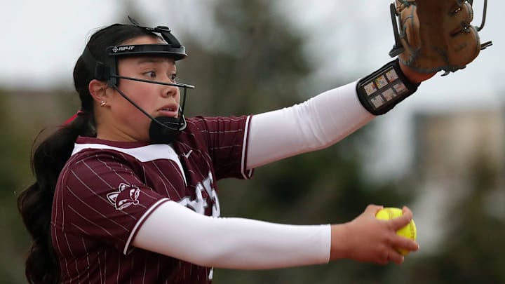 Fox Valley Lutheran's Madison Babcock (8) pitches against Freedom during a high school softball game on April 24, 2025.