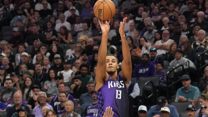 Apr 11, 2025; Sacramento, California, USA; Sacramento Kings forward Keegan Murray (13) shoots against Los Angeles Clippers guard Norman Powell (24) during the second quarter at Golden 1 Center. Mandatory Credit: Darren Yamashita-Imagn Images