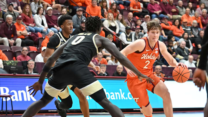 Feb 21, 2026; Blacksburg, Va.; Virginia Tech guard Jaden Schutt (2) drives, defended by Wake Forest forward Omaha Biliew (0).