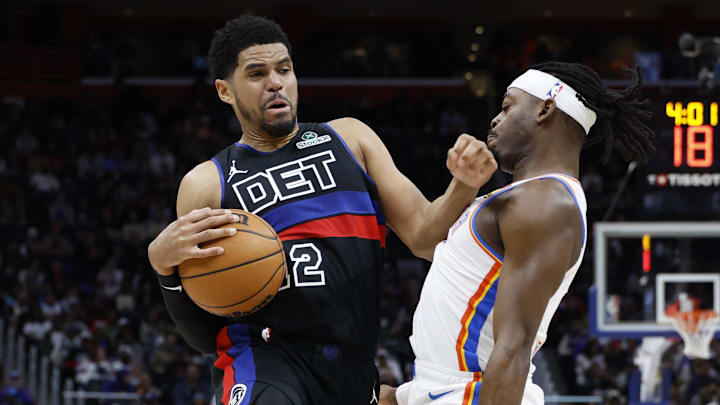 Mar 15, 2025; Detroit, Michigan, USA; Detroit Pistons forward Tobias Harris (12) dribbles on Oklahoma City Thunder guard Luguentz Dort (5) in the first half at Little Caesars Arena. Mandatory Credit: Rick Osentoski-Imagn Images Mar 15, 2025; Detroit, Michigan, USA; Detroit Pistons forward Tobias Harris (12) dribbles on Oklahoma City Thunder guard Luguentz Dort (5) in the first half at Little Caesars Arena. Mandatory Credit: Rick Osentoski-Imagn Images