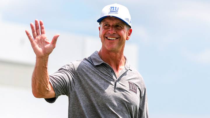 Aug 20, 2026; Miami Gardens, FL, USA; New York Giants head coach John Harbaugh reacts after joint practice with the Miami Dolphins at Baptist Health Training Complex.  