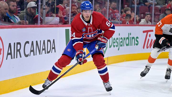 Sep 23, 2025; Montreal, Quebec, CAN; Montreal Canadiens defenseman David Reinbacher (64) plays the puck during the second period against the Philadelphia Flyers at the Bell Centre. Mandatory Credit: Eric Bolte-Imagn Images