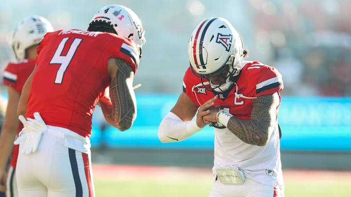 Oct 26, 2024; Tucson, Arizona, USA; Arizona Wildcats quarterback Noah Fifita (11) does handshake with Arizona Wildcats wide receiver Tetairoa McMillan (4) before the game against West Virginia Mountaineers at Arizona Stadium. Mandatory Credit: Aryanna Frank-Imagn Images