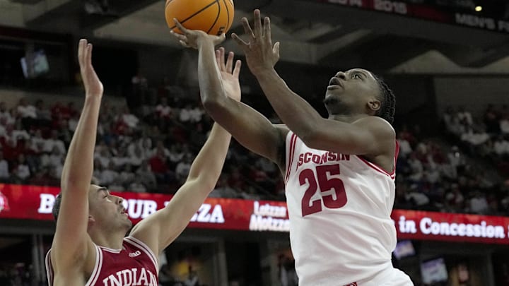 Indiana guard Trey Galloway (32) swats the ball from Wisconsin guard John Blackwell (25) during the second half of their game Tuesday, February 4, 2025 at the Kohl Center in Madison, Wisconsin. Wisconsin beat Indiana 76-64.