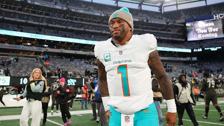 Dec 7, 2025; East Rutherford, New Jersey, USA; Miami Dolphins quarterback Tua Tagovailoa (1) walks on the field after the game against the New York Jets at MetLife Stadium. Mandatory Credit: Ed Mulholland-Imagn Images