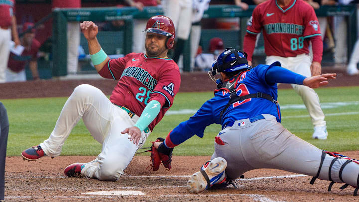 Mar 30, 2025; Phoenix, Arizona, USA; Chicago Cubs catcher Miguel Amaya (9) makes the tag to out Arizona Diamondbacks infielder Eugenio Suárez (28) in the eighth inning during a game at Chase Field. Mandatory Credit: Allan Henry-Imagn Images Mar 30, 2025; Phoenix, Arizona, USA; Chicago Cubs catcher Miguel Amaya (9) makes the tag to out Arizona Diamondbacks infielder Eugenio Suárez (28) in the eighth inning during a game at Chase Field. Mandatory Credit: Allan Henry-Imagn Images