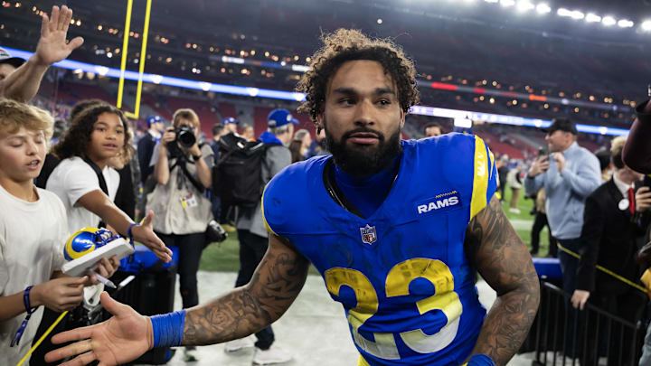 Jan 13, 2025; Glendale, AZ, USA; Los Angeles Rams running back Kyren Williams (23) celebrates after defeating the Minnesota Vikings during an NFC wild card game at State Farm Stadium. Mandatory Credit: Mark J. Rebilas-Imagn Images