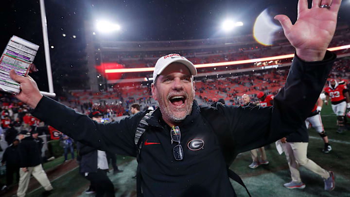 Georgia Offensive Coordinator Mike Bobo celebrates after wining a NCAA college football game against Ole Miss in Athens, Ga., on Saturday, Nov. 11, 2023. Georgia won 52-17.