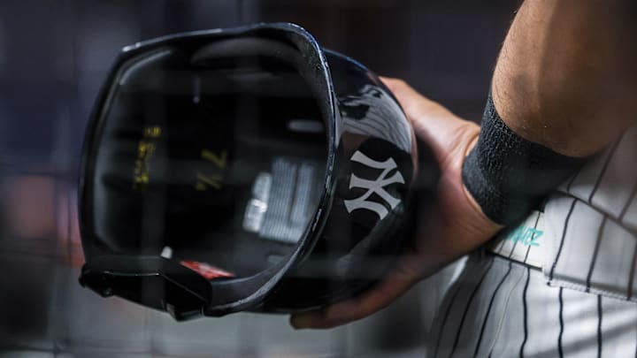 Aug 13, 2025; Bronx, New York, USA; A view of a battling helmet held by New York Yankees left fielder Jasson Dominguez (24) during the ninth inning against the Minnesota Twins  at Yankee Stadium. Mandatory Credit: Vincent Carchietta-Imagn Images