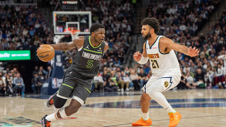 Nov 1, 2024; Minneapolis, Minnesota, USA; Minnesota Timberwolves guard Anthony Edwards (5) drives to the basket defended by Denver Nuggets guard Jamal Murray (27) in the second quarter at Target Center. Mandatory Credit: Matt Blewett-Imagn Images