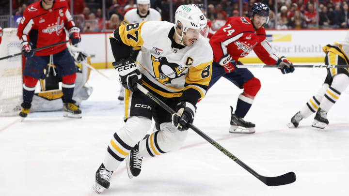Apr 4, 2024; Washington, District of Columbia, USA; Pittsburgh Penguins center Sidney Crosby (87) skates with the puck as Washington Capitals center Connor McMichael (24) chases in the first period at Capital One Arena. Mandatory Credit: Geoff Burke-USA TODAY Sports Apr 4, 2024; Washington, District of Columbia, USA; Pittsburgh Penguins center Sidney Crosby (87) skates with the puck as Washington Capitals center Connor McMichael (24) chases in the first period at Capital One Arena. Mandatory Credit: Geoff Burke-USA TODAY Sports