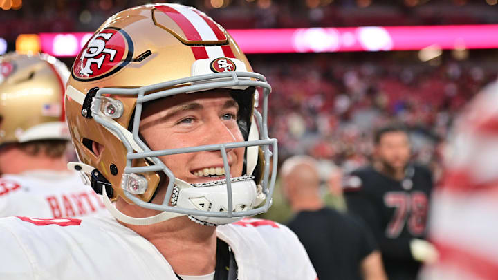 Nov 16, 2025; Glendale, Arizona, USA; San Francisco 49ers quarterback Mac Jones (10) looks on after defeating the Arizona Cardinals at State Farm Stadium. Mandatory Credit: Matt Kartozian-Imagn Images
