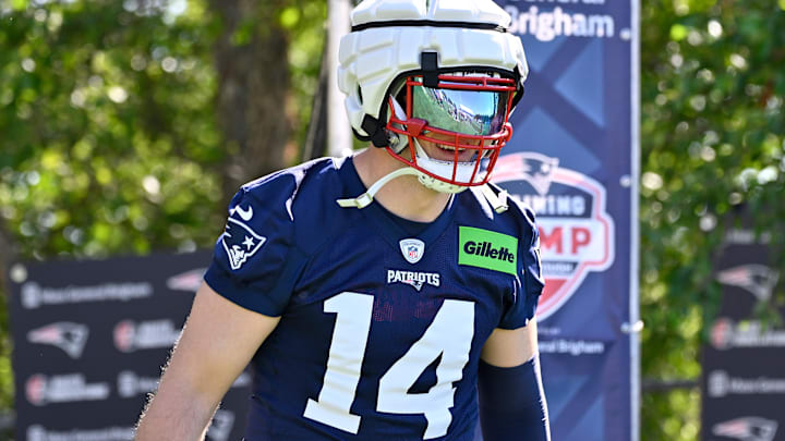New England Patriots linebacker Robert Spillane (14) walks to the practice fields for training camp at Gillette Stadium.