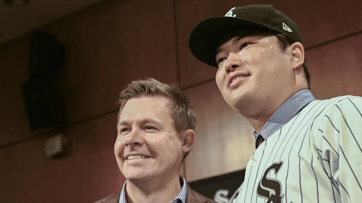 Dec 22, 2025; Chicago, Il, USA;  New Chicago White Sox player Munetaka Murakami, right, dons his hat with General Manager Chris Getz, left,  during a press conference  where he was introduced at Rate Field. Mandatory Credit: Matt Marton-Imagn Images