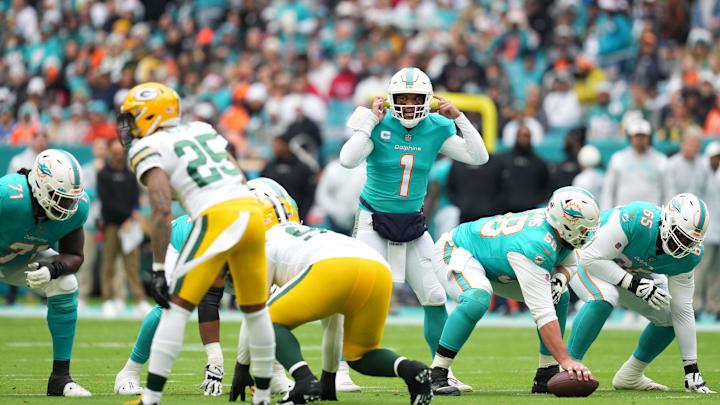 Dec 25, 2022; Miami Gardens, Florida, USA; Miami Dolphins quarterback Tua Tagovailoa (1) signals at
