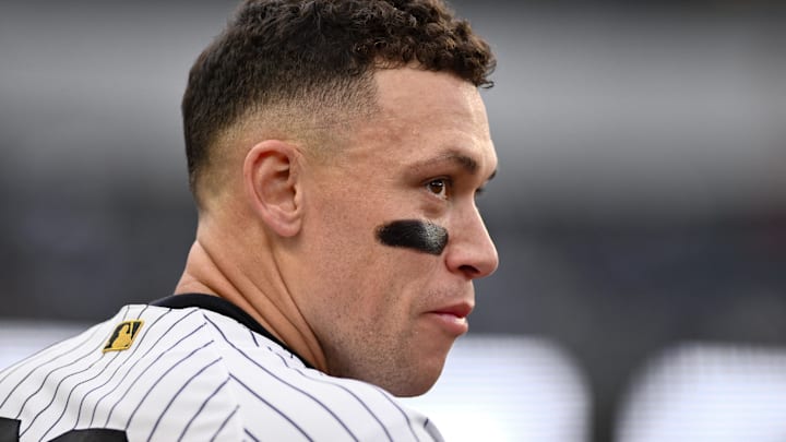 Apr 5, 2026; Bronx, New York, USA; New York Yankees right fielder Aaron Judge (99) looks on from the dugout after scoring a run against the Miami Marlins during the third inning at Yankee Stadium. Mandatory Credit: John Jones-Imagn Images Apr 5, 2026; Bronx, New York, USA; New York Yankees right fielder Aaron Judge (99) looks on from the dugout after scoring a run against the Miami Marlins during the third inning at Yankee Stadium. Mandatory Credit: John Jones-Imagn Images