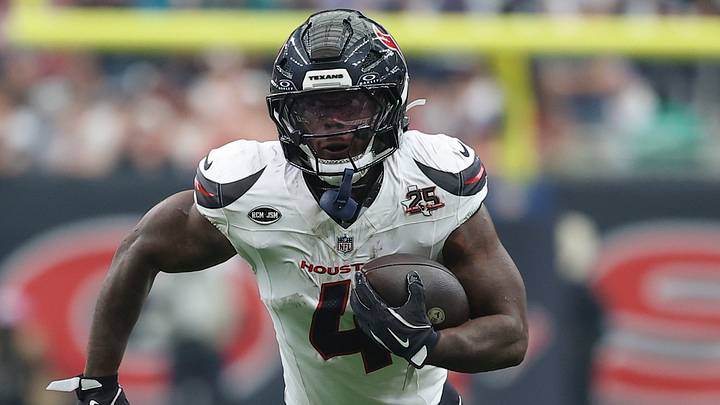 Houston Texans running back Woody Marks (4) runs with the ball during the game against the Dallas Cowboys at Reliant Stadium. Mandatory Credit: Troy Taormina-Imagn Images