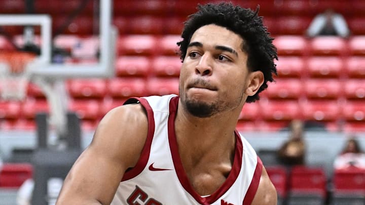 Oct 25, 2025; Pullman, WA, USA; Washington State Cougars guard Ace Glass Lll (21) controls the ball against the New Mexico Lobos in the second half at Friel Court at Beasley Coliseum. Mandatory Credit: James Snook-Imagn Images