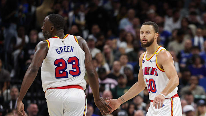 Feb 27, 2025; Orlando, Florida, USA; Golden State Warriors guard Stephen Curry (30) and forward Draymond Green (23) celebrate after a play against the Orlando Magic in the third quarter at Kia Center. Mandatory Credit: Nathan Ray Seebeck-Imagn Images