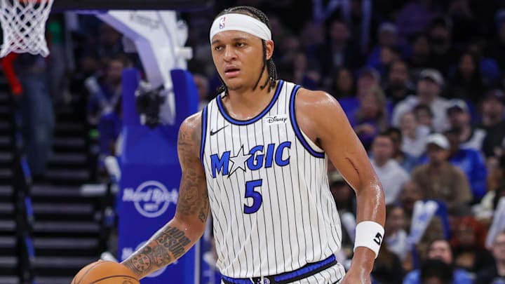 Jan 11, 2026; Orlando, Florida, USA; Orlando Magic forward Paolo Banchero (5) brings the ball up court during the second half against the New Orleans Pelicans at Kia Center. Mandatory Credit: Mike Watters-Imagn Images