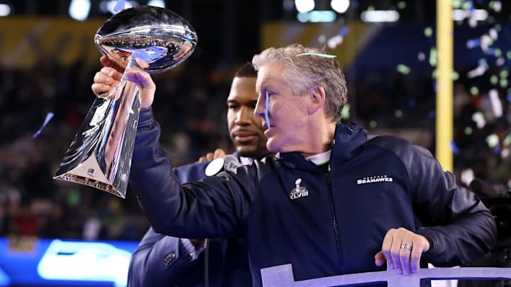 Seattle Seahawks head coach Pete Carroll celebrates with the Vince Lombardi Trophy after winning Super Bowl XLVIII. Seattle Seahawks head coach Pete Carroll celebrates with the Vince Lombardi Trophy after winning Super Bowl XLVIII.