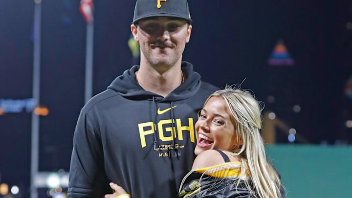 Pittsburgh Pirates starting pitcher Paul Skenes (30) poses with his girlfriend Louisiana State University gymnast Livvy Dunne (right) after Skenes made his major league debut against the Chicago Cubs.