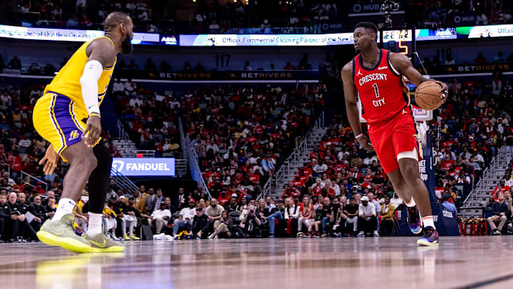 Apr 16, 2024; New Orleans, Louisiana, USA; New Orleans Pelicans forward Zion Williamson (1) dribbles against Los Angeles Lakers forward LeBron James (23) during the first half of a play-in game of the 2024 NBA playoffs against the New Orleans Pelicans at Smoothie King Center. Mandatory Credit: Stephen Lew-Imagn Images Apr 16, 2024; New Orleans, Louisiana, USA; New Orleans Pelicans forward Zion Williamson (1) dribbles against Los Angeles Lakers forward LeBron James (23) during the first half of a play-in game of the 2024 NBA playoffs against the New Orleans Pelicans at Smoothie King Center. Mandatory Credit: Stephen Lew-Imagn Images