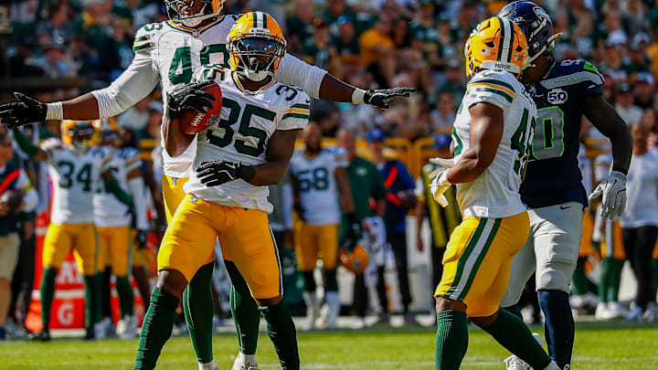 Green Bay Packers linebacker Jamon Johnson and cornerback Corey Ballentine celebrate after Ballentine recovers a muffed punt.