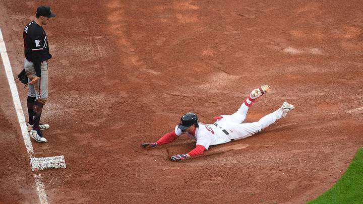 May 24, 2026; Boston, Massachusetts, USA;  Boston Red Sox second baseman Nick Sogard (20) slides into third base for a triple during the ninth inning against the Minnesota Twins at Fenway Park. Mandatory Credit: Bob DeChiara-Imagn Images