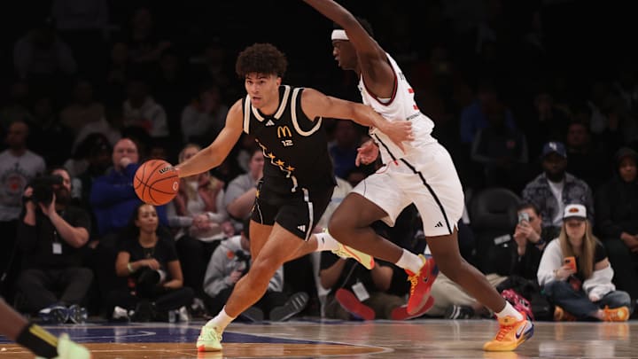 Apr 1, 2025; Brooklyn, NY, USA; McDonald's All American East forward Cameron Boozer (12) dribbles the ball against McDonald's All American West forward AJ Dybantsa (3) during the second half of the game at Barclays Center. Mandatory Credit: Pamela Smith-Imagn Images