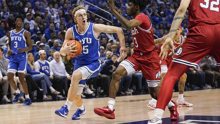 Jan 24, 2026; Provo, Utah, USA; BYU Cougars guard Richie Saunders (15) drives to the basket during the first half against the Utah Utes at Marriott Center. Mandatory Credit: Aaron Baker-Imagn Images 