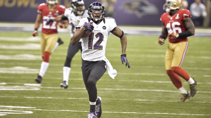 Feb 3, 2013; Baltimore Ravens receiver Jacoby Jones (12) returns a kickoff for a touchdown against the San Francisco 49ers during Super Bowl XLVII