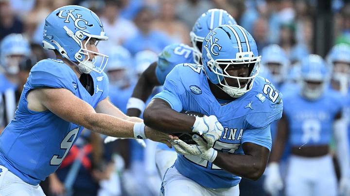 Oct 3, 2026; Chapel Hill, North Carolina, USA; North Carolina Tar Heels quarterback Billy Edwards Jr. (9) hands the ball off to running back Jaylen McGill (27) in the first quarter at Kenan Stadium. Mandatory Credit: Bob Donnan-Imagn Images Oct 3, 2026; Chapel Hill, North Carolina, USA; North Carolina Tar Heels quarterback Billy Edwards Jr. (9) hands the ball off to running back Jaylen McGill (27) in the first quarter at Kenan Stadium. Mandatory Credit: Bob Donnan-Imagn Images