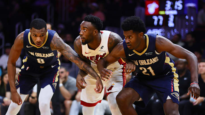Oct 13, 2024; Miami, Florida, USA; Miami Heat forward Nassir Little (25) is defended by New Orleans Pelicans forward Jamal Cain (8) and center Yves Missi (21) during the third quarter at Kaseya Center. Mandatory Credit: Sam Navarro-Imagn Images Oct 13, 2024; Miami, Florida, USA; Miami Heat forward Nassir Little (25) is defended by New Orleans Pelicans forward Jamal Cain (8) and center Yves Missi (21) during the third quarter at Kaseya Center. Mandatory Credit: Sam Navarro-Imagn Images