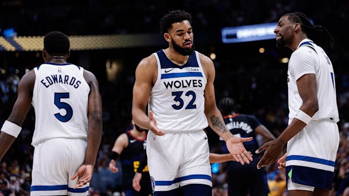 May 14, 2024; Denver, Colorado, USA; Minnesota Timberwolves center Karl-Anthony Towns (32) reacts with center Naz Reid (11) and guard Anthony Edwards (5) Mandatory Credit: Isaiah J. Downing-USA TODAY Sports