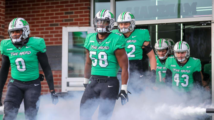 Nov 27, 2021; Huntington, West Virginia, USA; Marshall Thundering Herd defensive lineman Elijah Alston (58) runs onto the field prior to their game against the Western Kentucky Hilltoppers at Joan C. Edwards Stadium. Mandatory Credit: Ben Queen-USA TODAY Sports