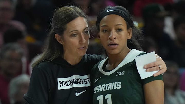 Feb 19, 2025; Los Angeles, California, USA; Michigan State Spartans head coach Robyn Fralick (left) talks with guard Jocelyn Tate (11) against the Southern California Trojans in the second half at the Galen Center. Mandatory Credit: Kirby Lee-Imagn Images