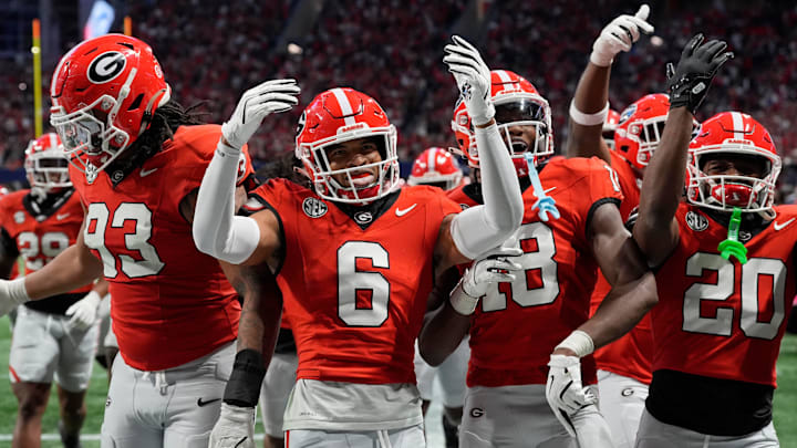 Georgia defensive back Daylen Everette (6) celebrates with his teammates after picking off a pass from Texas quarterback Quinn Ewers (3) during the second half of the SEC championship game against Texas in Atlanta, on Saturday, Dec. 7, 2024. Georgia defensive back Daylen Everette (6) celebrates with his teammates after picking off a pass from Texas quarterback Quinn Ewers (3) during the second half of the SEC championship game against Texas in Atlanta, on Saturday, Dec. 7, 2024.