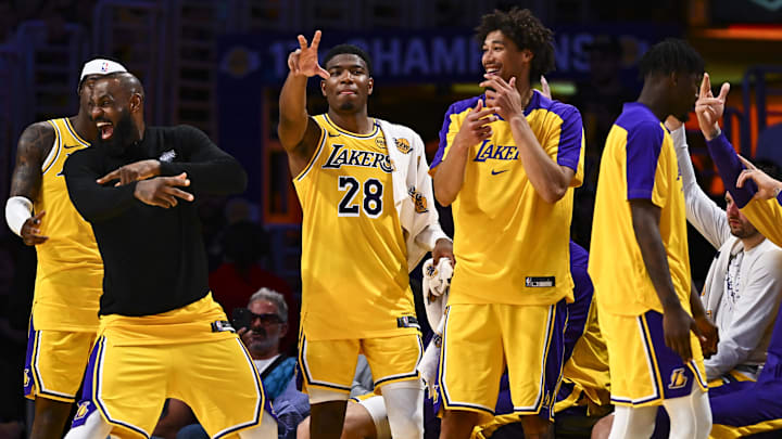 Apr 11, 2025; Los Angeles, California, USA; Los Angeles Lakers forward Jarred Vanderbilt (2), forward LeBron James (23), forward Rui Hachimura (28), center Jaxson Hayes (11), and Los Angeles Lakers guard Luka Doncic (77) celebrate after scoring against the Houston Rockets during the second half at Crypto.com Arena. Mandatory Credit: Jonathan Hui-Imagn Images