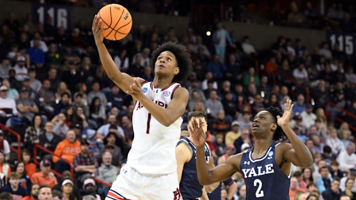Mar 22, 2024; Spokane, WA, USA; Auburn Tigers guard Aden Holloway (1) attempts a layup against Yale