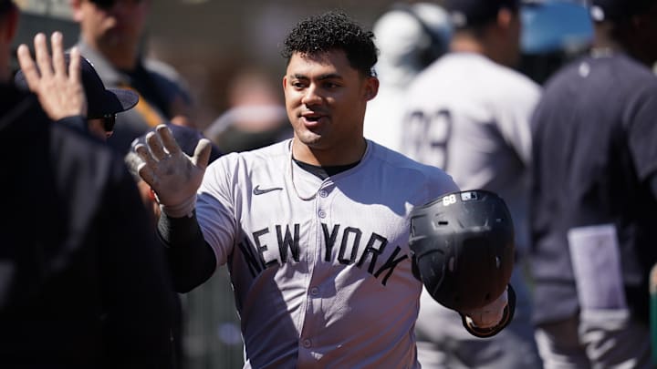 Sep 22, 2024; Oakland, California, USA; New York Yankees left fielder Jasson Dominguez (89) is congratulated by teammates after hitting a two-run home run against the Oakland Athletics in the second inning at the Oakland-Alameda County Coliseum. 