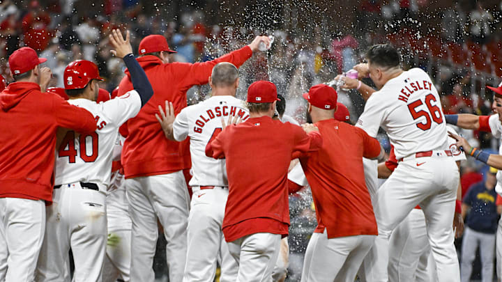 Aug 21, 2024; St. Louis, Missouri, USA; St. Louis Cardinals third baseman Nolan Arenado (28) celebrates with teammates after hitting a walk-off grand slam against the Milwaukee Brewers during the tenth inning at Busch Stadium. Mandatory Credit: Jeff Curry-Imagn Images Aug 21, 2024; St. Louis, Missouri, USA; St. Louis Cardinals third baseman Nolan Arenado (28) celebrates with teammates after hitting a walk-off grand slam against the Milwaukee Brewers during the tenth inning at Busch Stadium. Mandatory Credit: Jeff Curry-Imagn Images