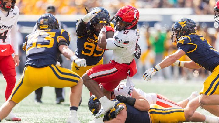 Oct 17, 2026; Morgantown, West Virginia, USA; Cincinnati Bearcats running back Gi'bran Payne (6) runs the ball during the first quarter against the West Virginia Mountaineers at Milan Puskar Stadium. Mandatory Credit: Ben Queen-Imagn Images Oct 17, 2026; Morgantown, West Virginia, USA; Cincinnati Bearcats running back Gi'bran Payne (6) runs the ball during the first quarter against the West Virginia Mountaineers at Milan Puskar Stadium. Mandatory Credit: Ben Queen-Imagn Images