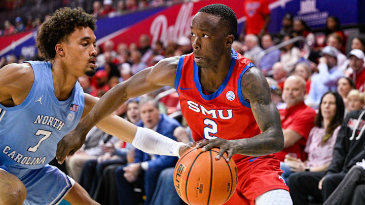 Jan 3, 2026; Dallas, Texas, USA; SMU Mustangs guard Boopie Miller (2) drives to the basket past North Carolina Tar Heels guard Seth Trimble (7) during the second half at Moody Coliseum.