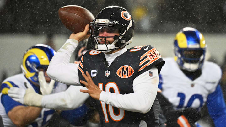 Bears quarterback Caleb Williams tries to dump off a pass against the Los Angeles Rams in the playoffs at Soldier Field. Bears quarterback Caleb Williams tries to dump off a pass against the Los Angeles Rams in the playoffs at Soldier Field.
