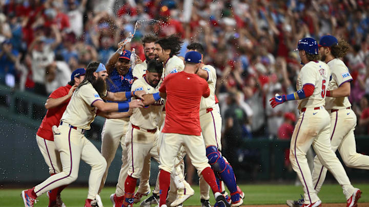 Oct 6, 2024; Philadelphia, Pennsylvania, USA; Philadelphia Phillies outfielder Nick Castellanos (8) celebrates with teammates after defeating the New York Mets during game two of the NLDS for the 2024 MLB Playoffs at Citizens Bank Park. 