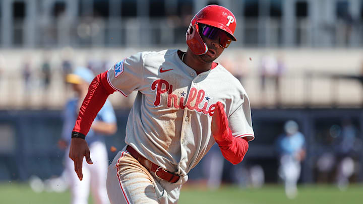 Feb 25, 2025; Port Charlotte, Florida, USA;  Philadelphia Phillies outfielder Justin Crawford (80) runs home to score against the Tampa Bay Rays during the fourth inning at Charlotte Sports Park.
