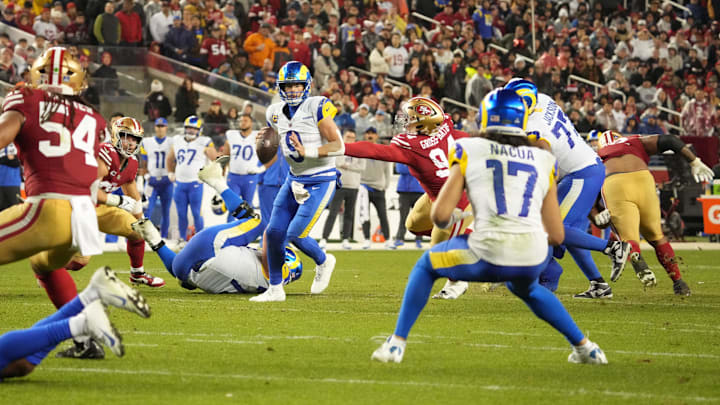 Dec 12, 2024; Santa Clara, California, USA; Los Angeles Rams quarterback Matthew Stafford (9) looks to pass the ball to wide receiver Puka Nacua (17) during the fourth quarter at Levi's Stadium. Mandatory Credit: Kelley L Cox-Imagn Images